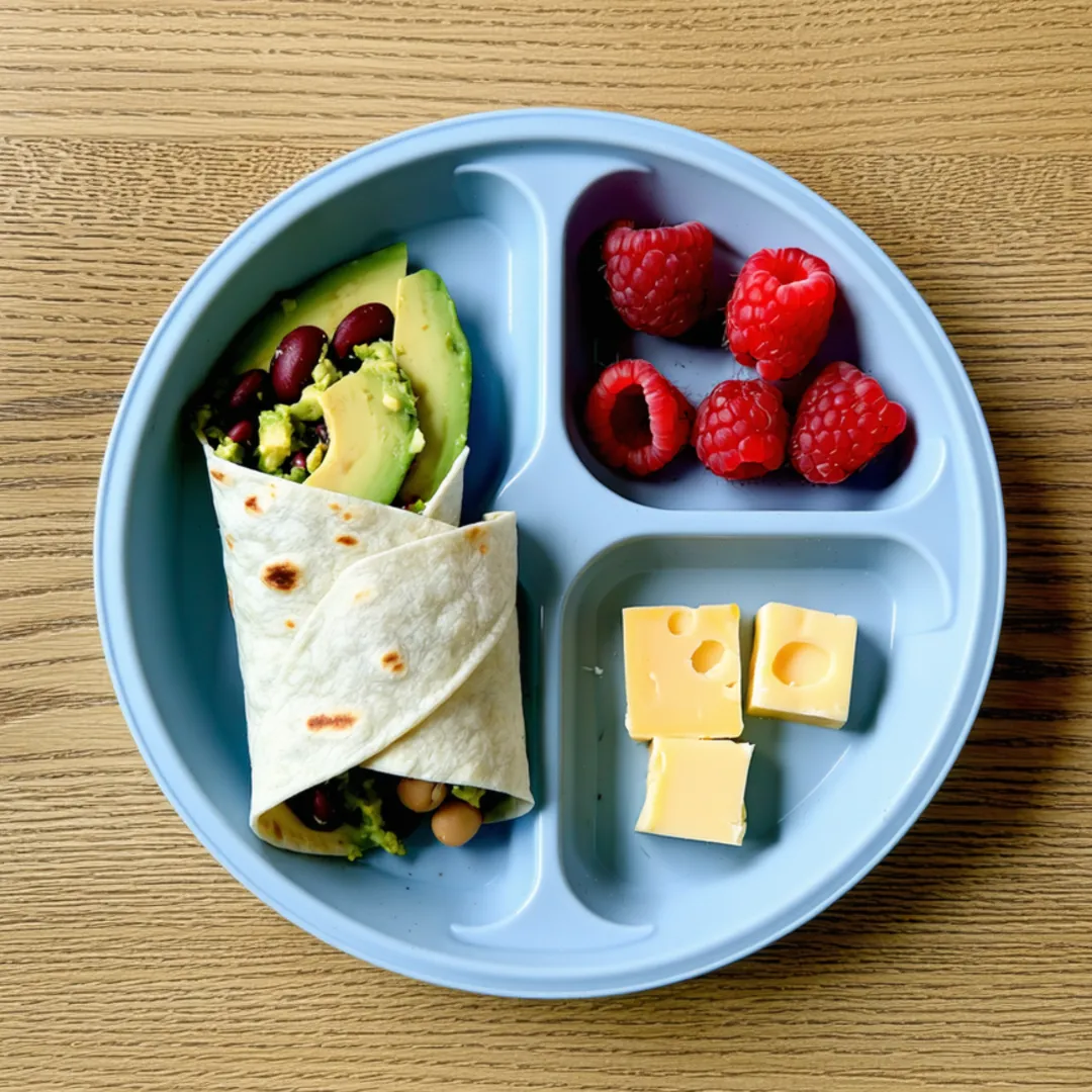 Bean and avocado pinwheels, raspberries and cheese cubes